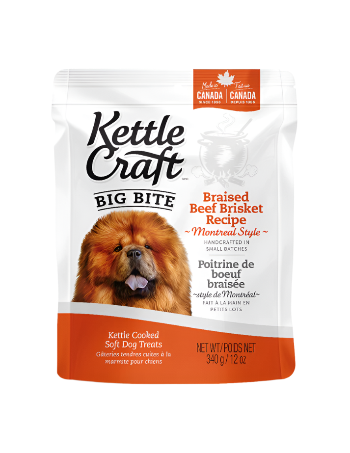 A package of Kettle Craft Big Bite dog treats with an image of a dog on the front, specifically braised beef brisket flavor.