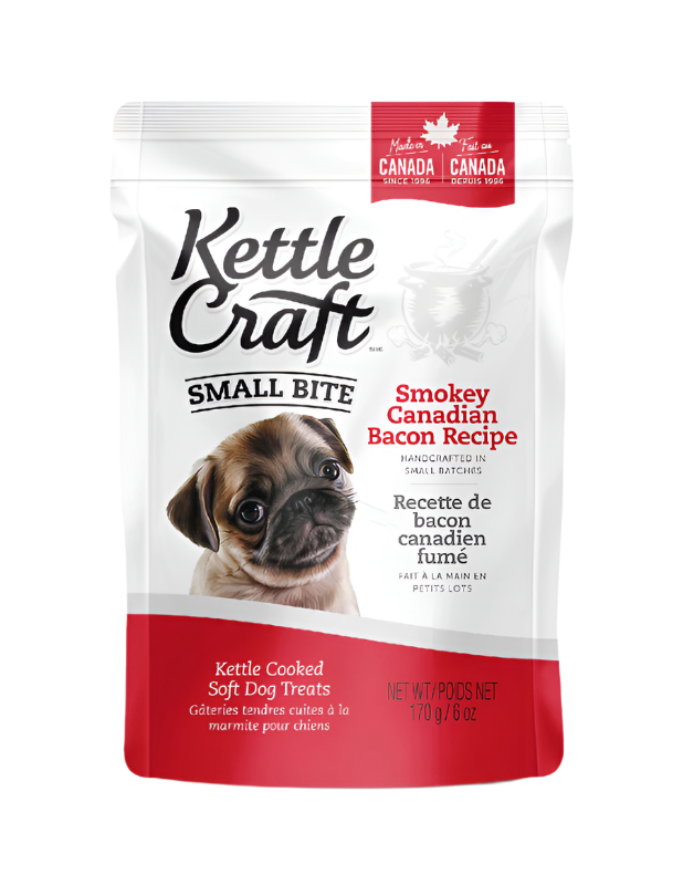 A package of Kettle Craft Small Bite Dog Treats with Smokey Canadian Bacon flavor. The package is predominantly white, with images of the product and a dog on the front.