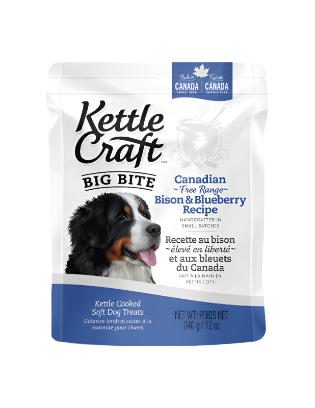 Package of Kettle Craft Big Bite dog treats with an image of a dog on the front and text highlighting the Canadian free range bison and blueberry recipe.