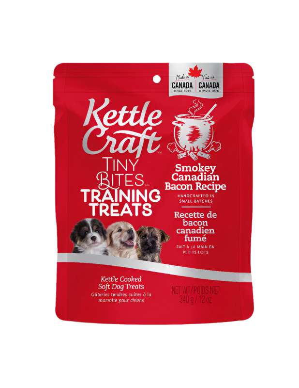 A package of Kettle Craft Tiny Bites training treats with Smokey Canadian Bacon Recipe. The packaging is predominantly red with images of dogs and text displaying the product name and recipe.
