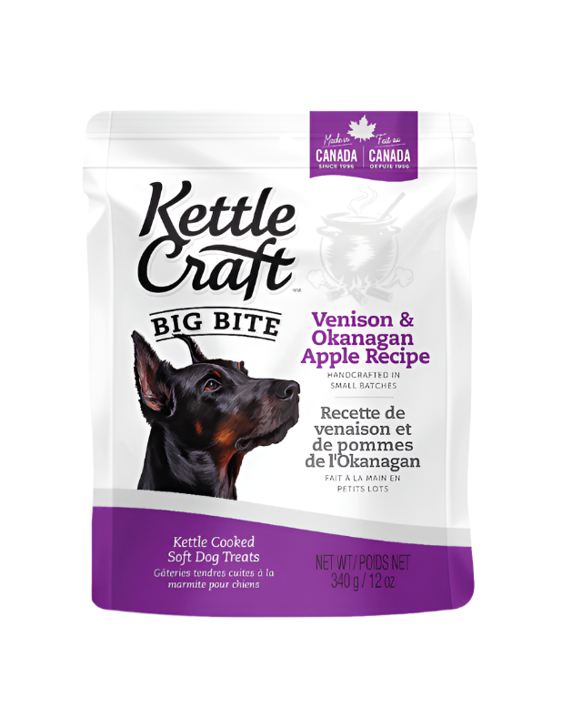 A package of Kettle Craft Small Bite dog treats with Venison & Okanagan Apple recipe. The package is predominantly white with images of a dog and product information.