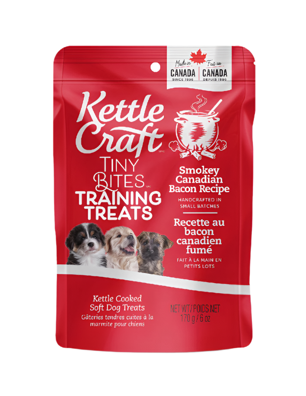 A package of Kettle Craft Tiny Bites training treats with Smokey Canadian Bacon Recipe. The packaging is predominantly red with images of dogs and text displaying the product name and recipe.